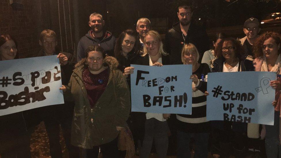 Friends of Bashir Naderi attend an awareness raising event for the 'Stand Up for Bash' campaign in Cardiff on Tuesday