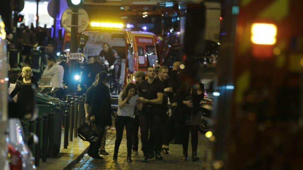 French security moves people in the area of Rue Bichat in the 10th arrondissement of the French capital Paris following a string of attacks on 13 November 2015