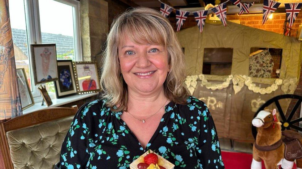 Karen Harris holding a tiramisu