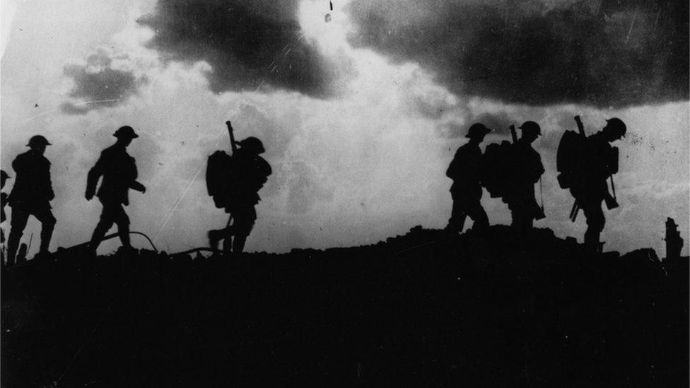 Silhouette of British soldiers moving up and out of the trenches, East of Ypres, October 1917