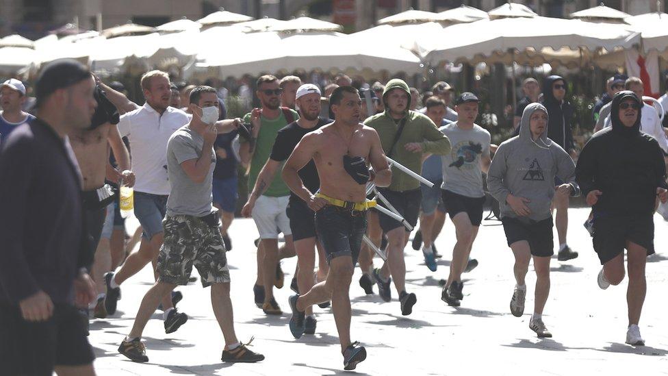 Russian fans rush England fans ahead of the Russia-England game on June 11, 2016 in Marseille, France.