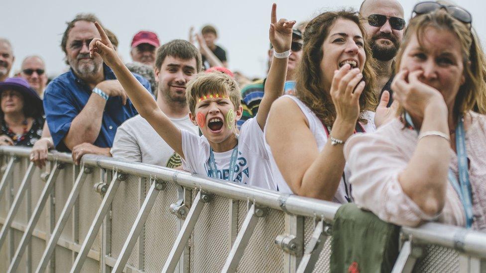 A young festival-goer amongst the crowd at Victorious Festival in Portsmouth