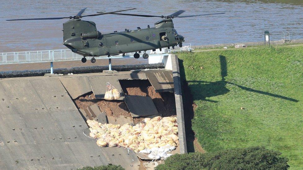 Helicopter drops supplies