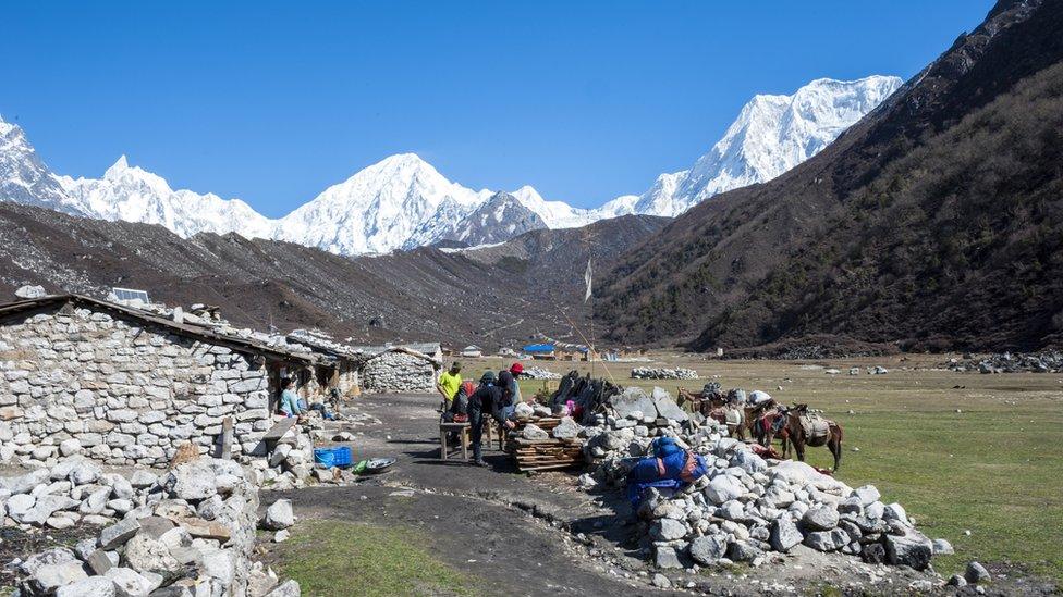 Trekkers in the village of Bimthang as part of the Great Himalaya Trail