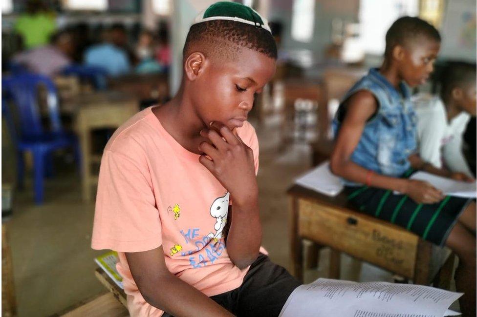 Igbo Jewish child studying in a religious class