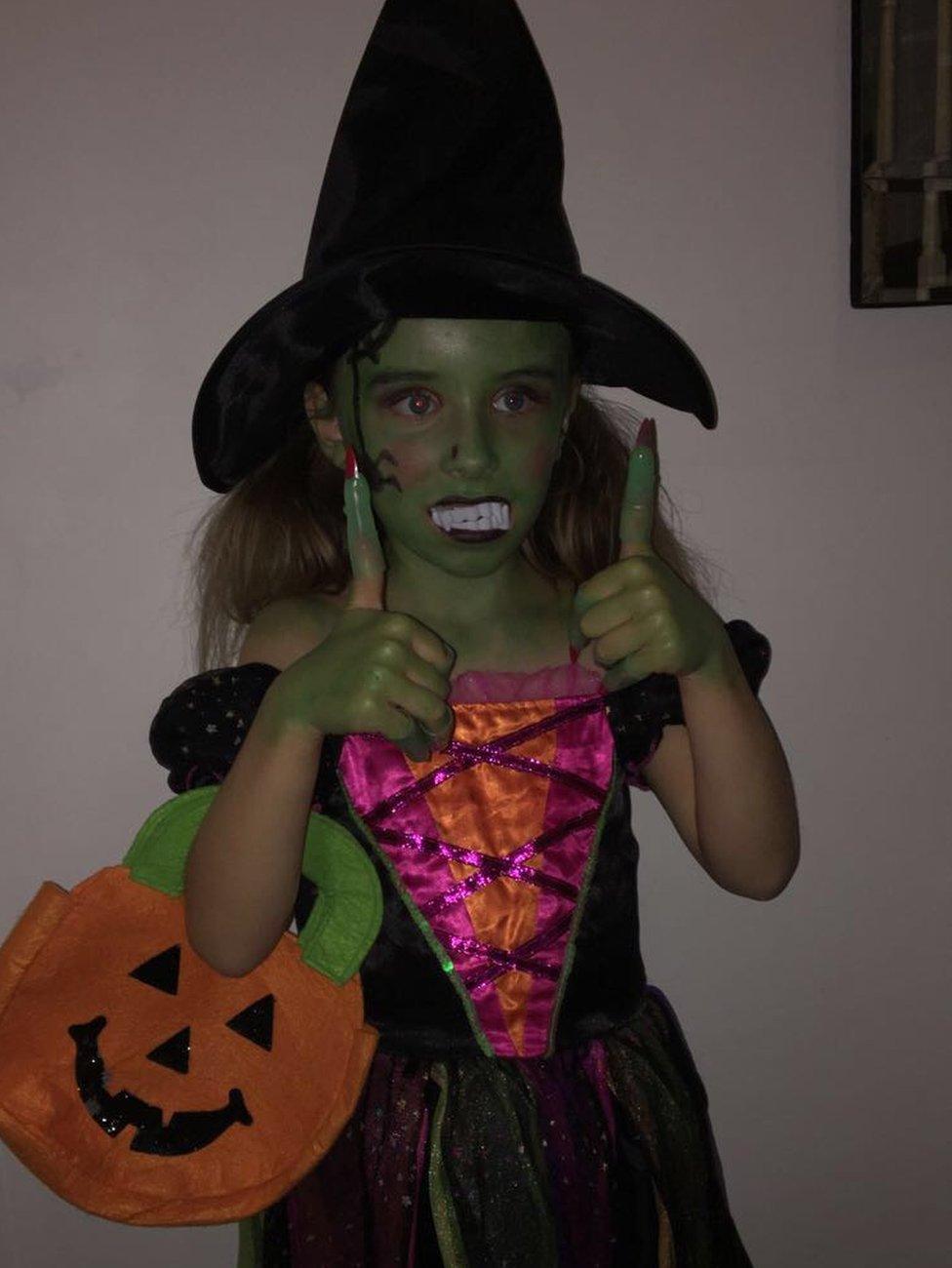 Here's seven-year-old Isla from Wrexham as a very spooky - and very green - witch