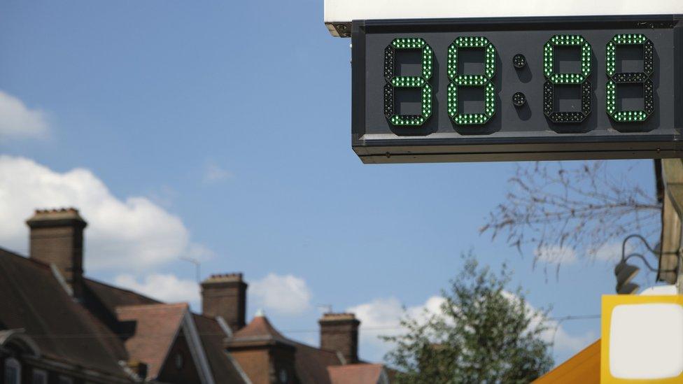 A digital thermometer in London showing the temperature during the UK heat wave. It reads 38 °C