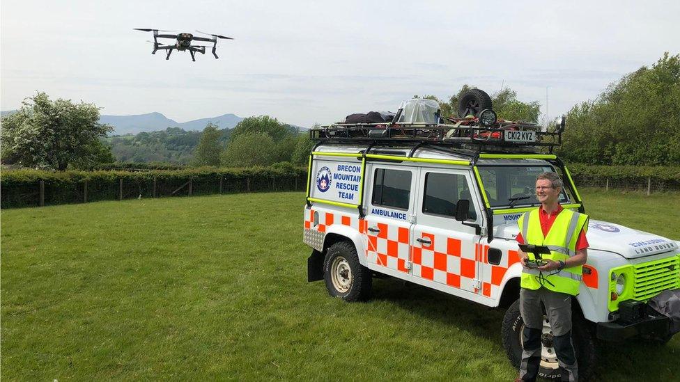 The drone being operated by a member of the team