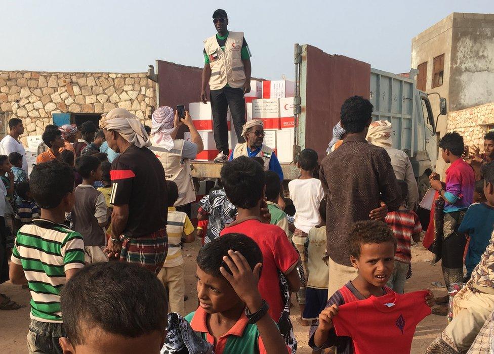 Emirates Red Crescent workers handing out aid in Socotra, Yemen, 2018