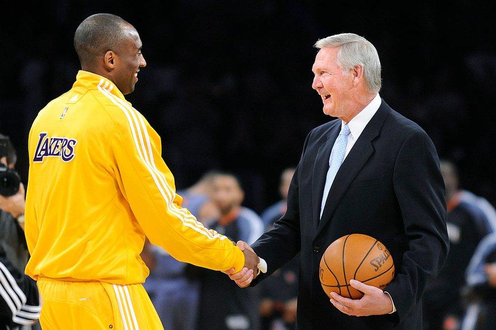 Kobe Bryant shaking hands with Jerry West