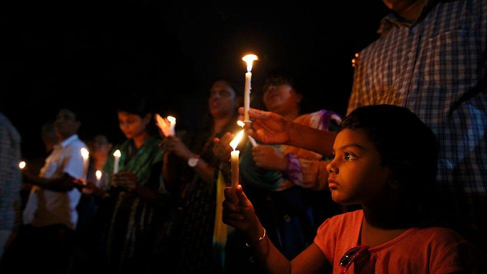 People take part a candle-light vigil organised by Sammilito Sangskritik Jote, an organisation of cultural activists, at Central Shaheed Minar to remember the victims of the Gulshan cafe attack on July 3, 2016 in Dhaka, Bangladesh.