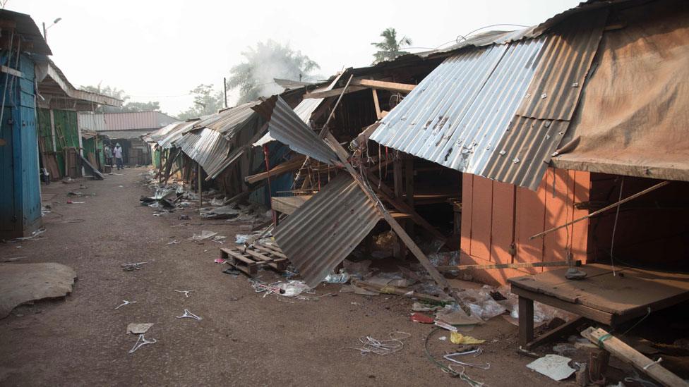 A picture taken on December 26, 2019 shows ransacked shops in a street of the PK5 district in Bangui after clashes erupted after traders took up arms to oppose taxes levied by militia groups.