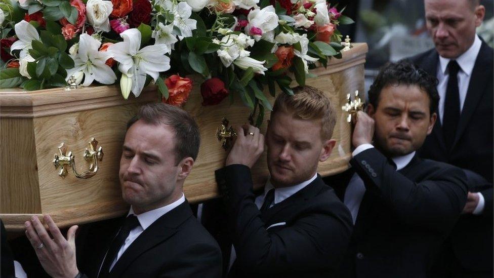 Cast members (left to right) Alan Halsall, Mikey North and Ryan Thomas carry the coffin of Coronation Street creator and writer Tony Warren