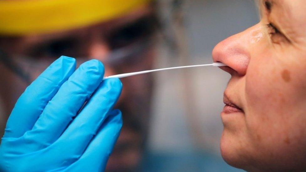 A swab test being taken