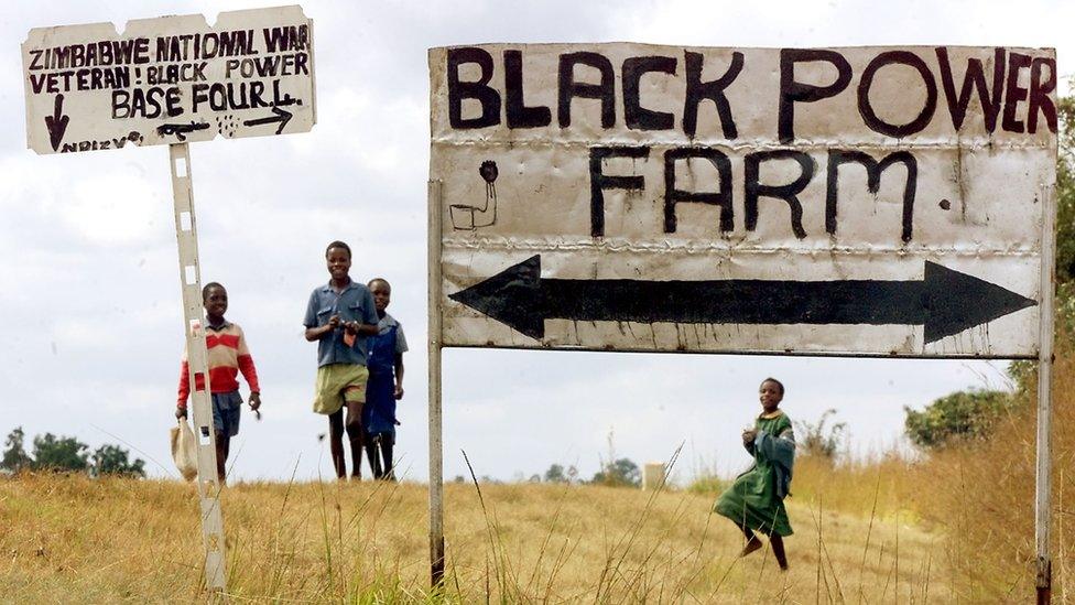 The entrance of an occupied farm in Zimbabwe in 2000