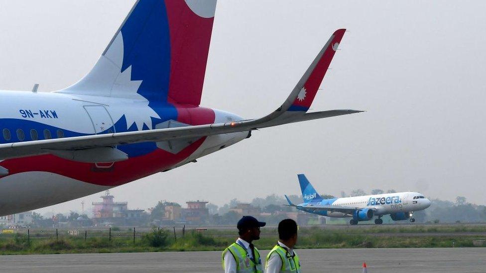 A Jazeera Airways aircraft lands at the newly built Gautam Buddha International Airport following its inauguration in Siddharthanagar on May 16, 2022