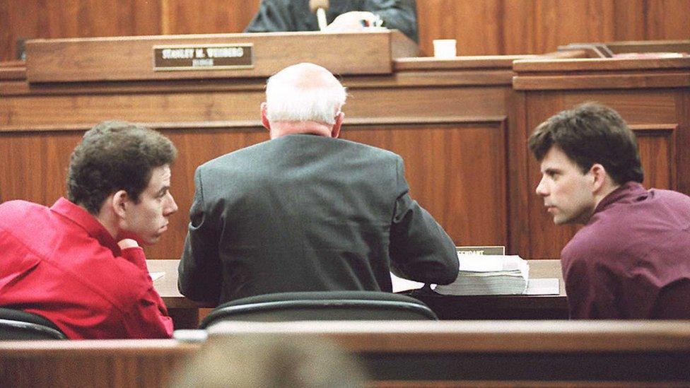 The brothers confer during their 1995 trial