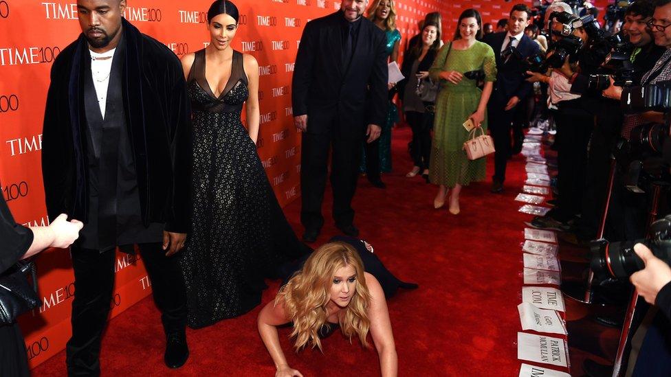 Amy Schumer falls at the feet of Kanye West and Kim Kardashian