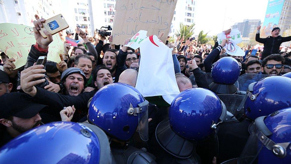 Algerian protesters chant slogans during a demonstration protest