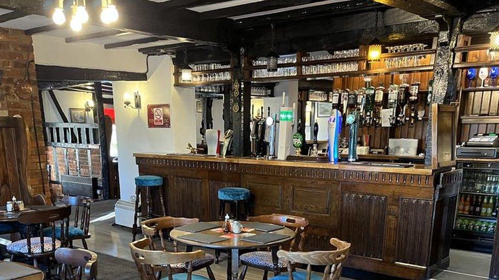 The interior and bar of the Oakwood Inn.