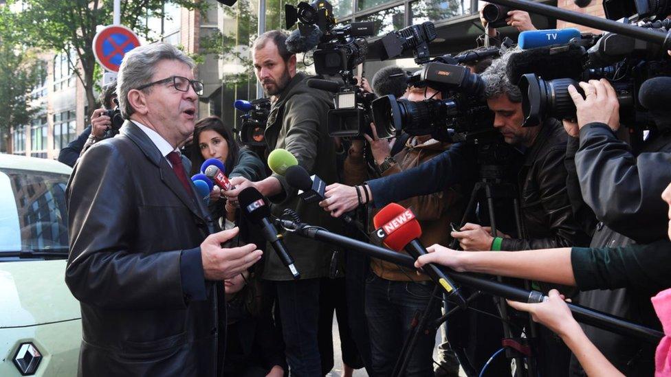 Jean-Luc Mélenchon speaks to reporters in October 2018