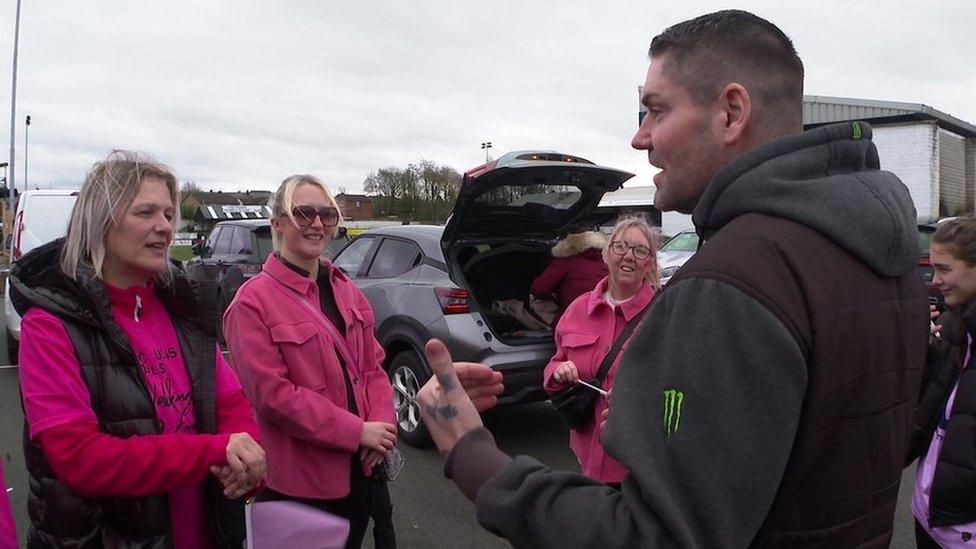 Shane Lynch talking to fundraising walkers