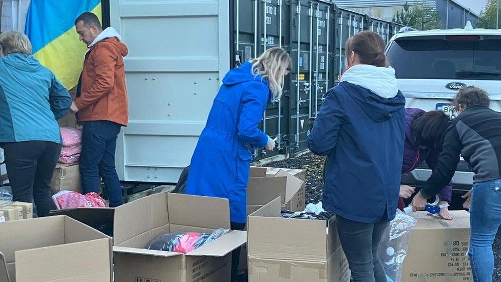 Aid boxes being packed by volunteers