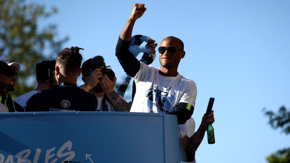 Vincent Kompany celebrates on the parade bus