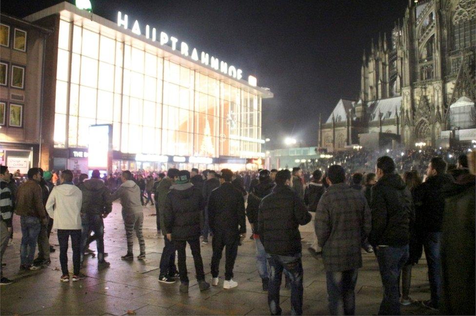 Picture taken on 31 December2015 shows people gathering in front of the main railway station in Cologne, western German