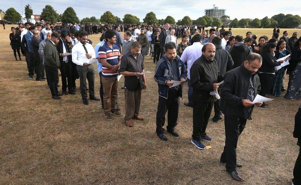 Mourners queue to see the open coffins on Winn's Common