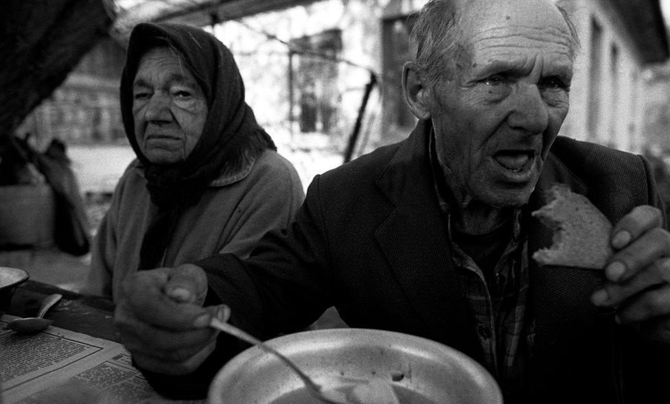 Maria and Ivan Semieniuk having supper