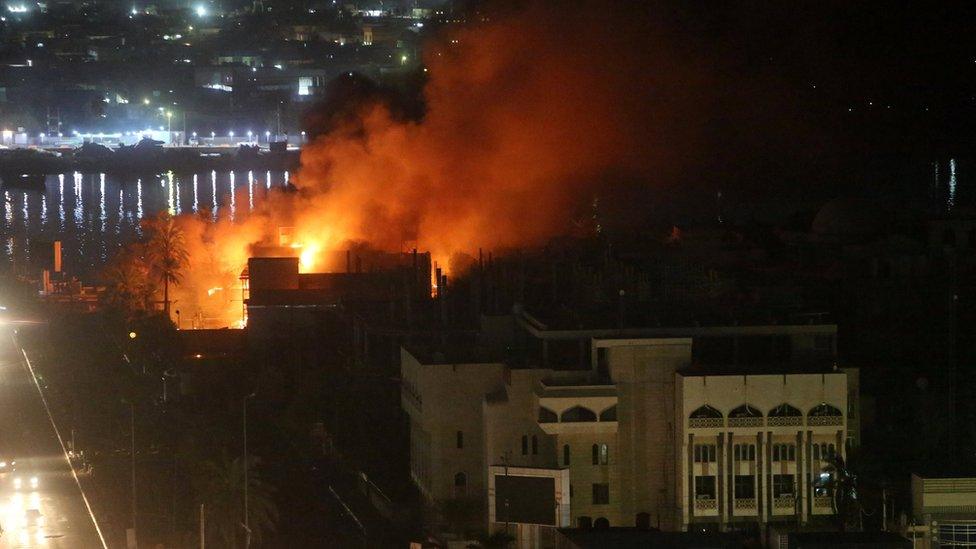 Smoke rises from the Guest House building in Basra, 6 September 2018