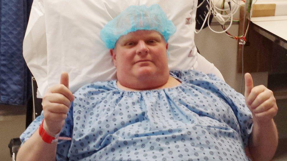 In this Monday, May 11, 2015 photo provided by Dan Jacobs, former Toronto Mayor Rob Ford gives a thumbs up before surgery in Toronto, to remove a cancerous tumour from his abdomen.