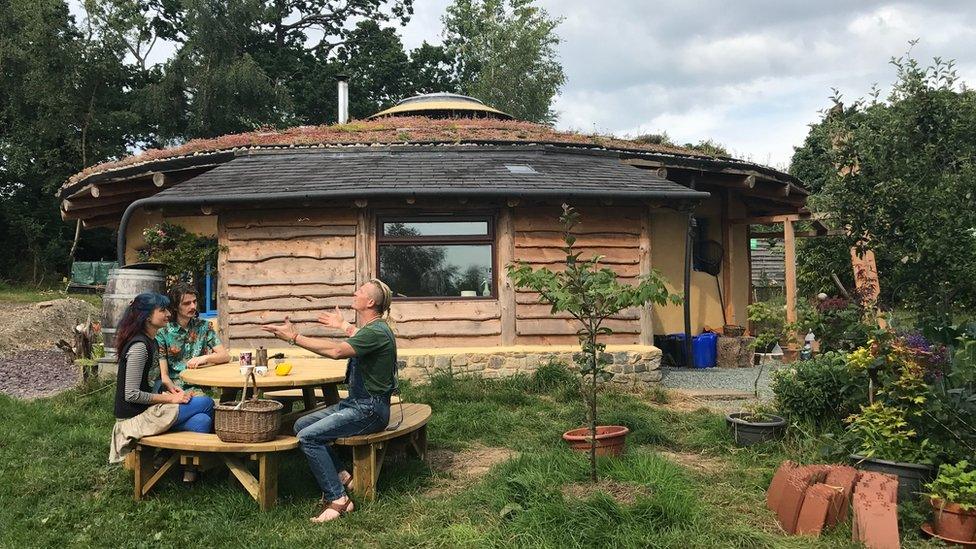 Soma, Janta, and Merav Wheelhouse at their straw bale roundhouse