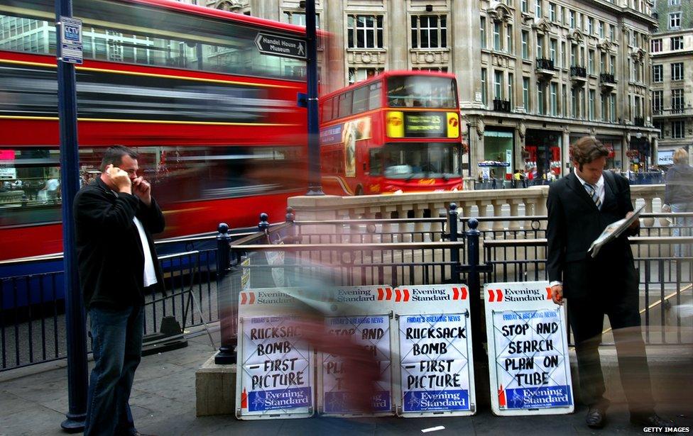 London Oxford Street - commuters read papers after 21 July bombings