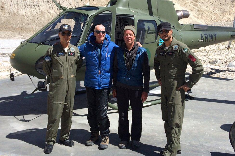 Rick Allen, in blue jacket, and Sandy Allan with helicopter crew after Mr Allen's rescue