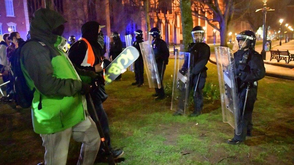 Protesters and police at the scene