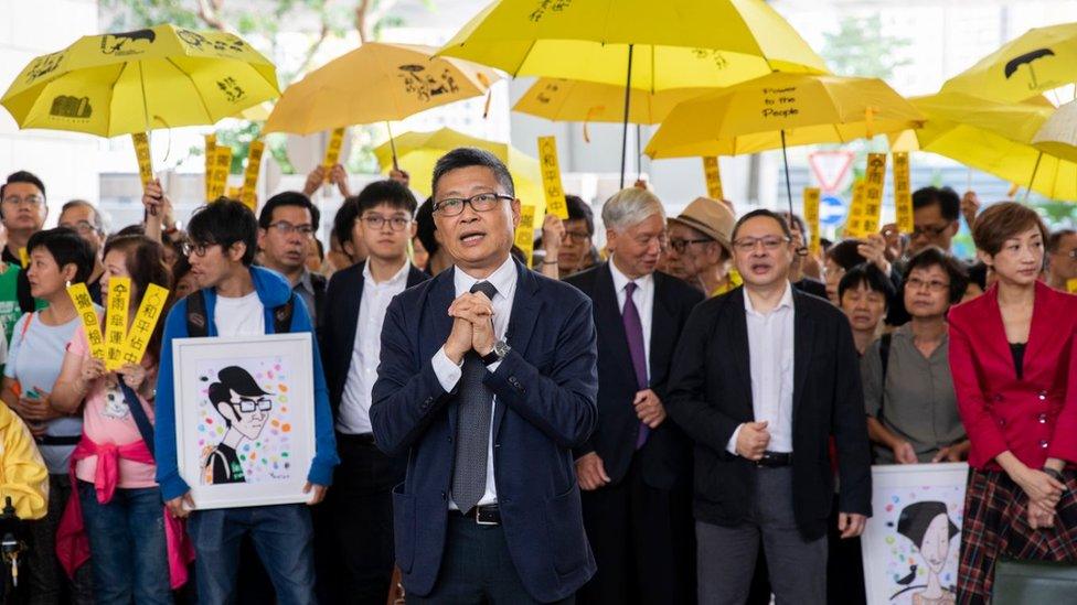 Dr Chan Kin-man and his fellow accused before entering court