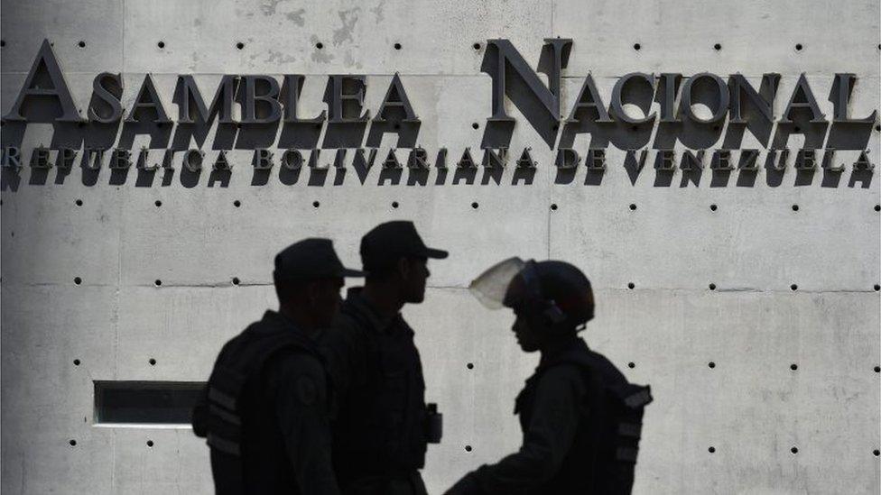 Members of Venezuela's Bolivarian National Guard block access to the Federal Legislative Palace, which houses both the opposition-led National Assembly and the pro-government National Constituent Assembly, in Caracas on May 15, 2019.