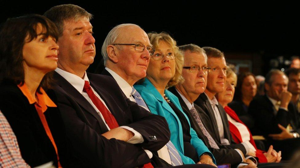 Liberal Democrat politicians listen to Tim Farron's speech