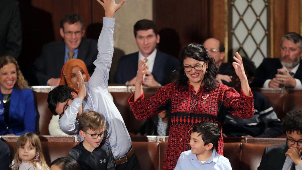 Ms Tlaib laughs as one of her children breaks into dabbing, a type of dance move, after she casts a vote for Speaker Pelosi