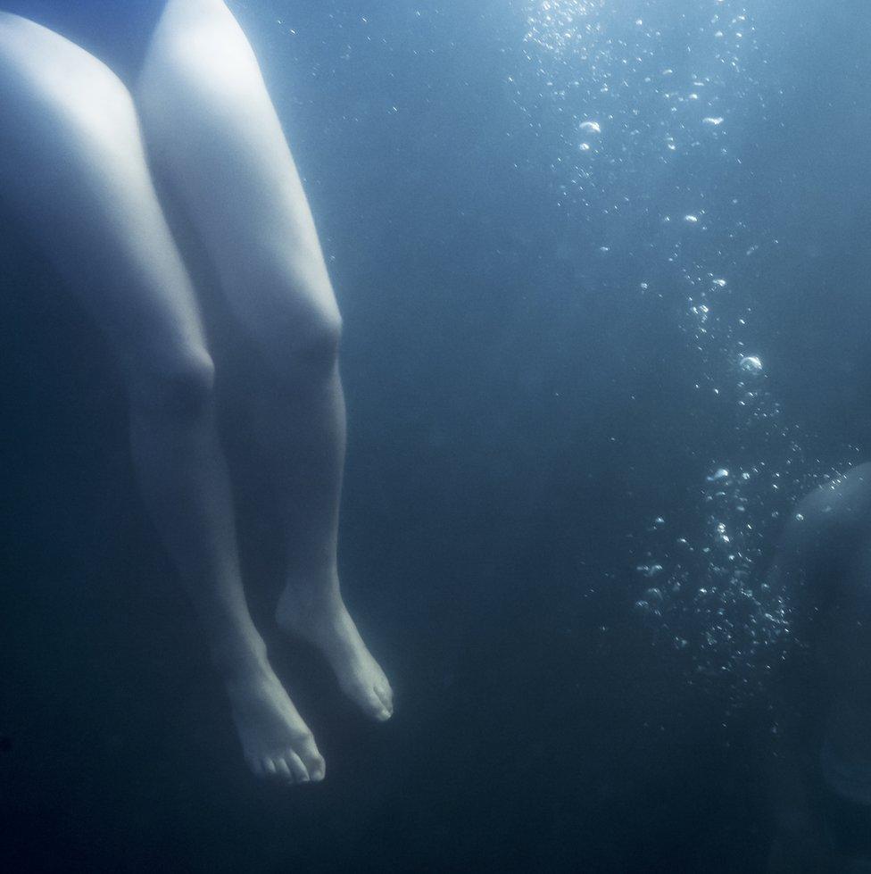 Legs underwater