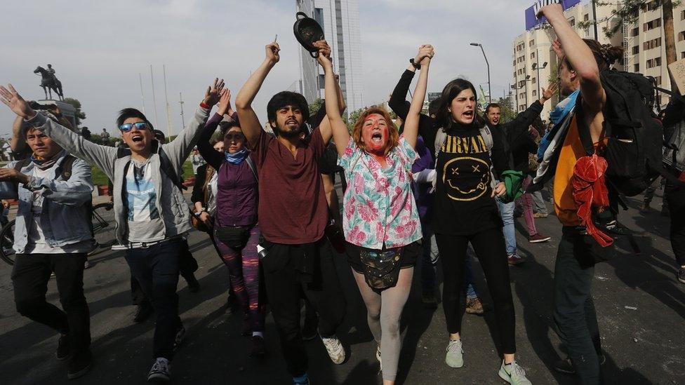 Anti-government demonstrators protest against cost of living increases in Santiago