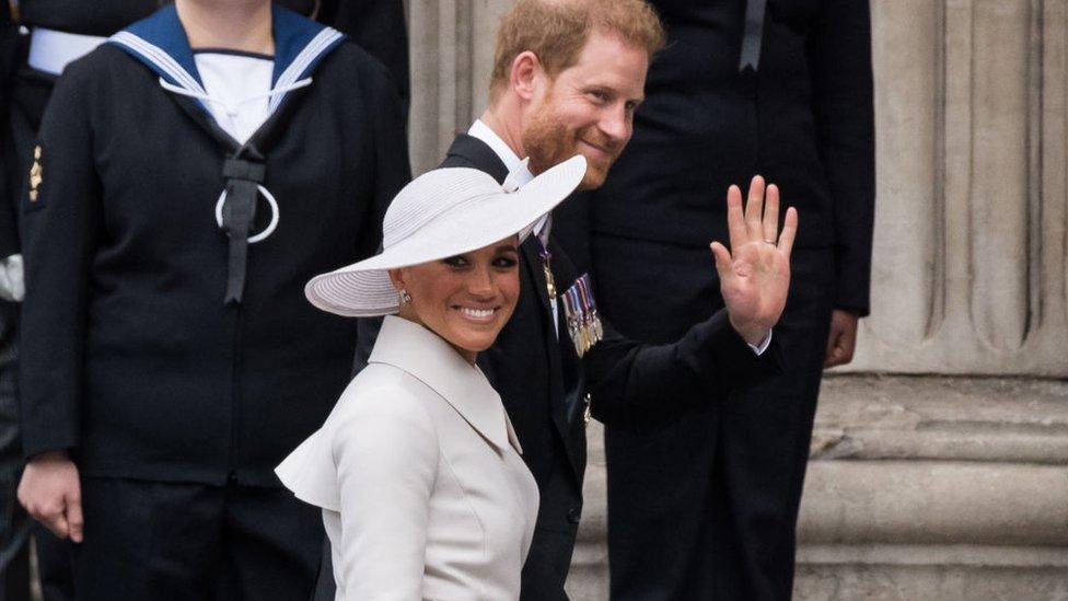 Prince Harry and his wife Meghan on the steps of St Paul's Cathedral.