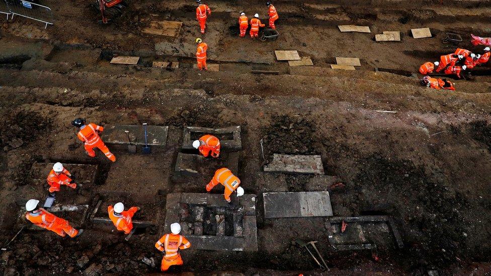 Archaeologists work on the excavation in London