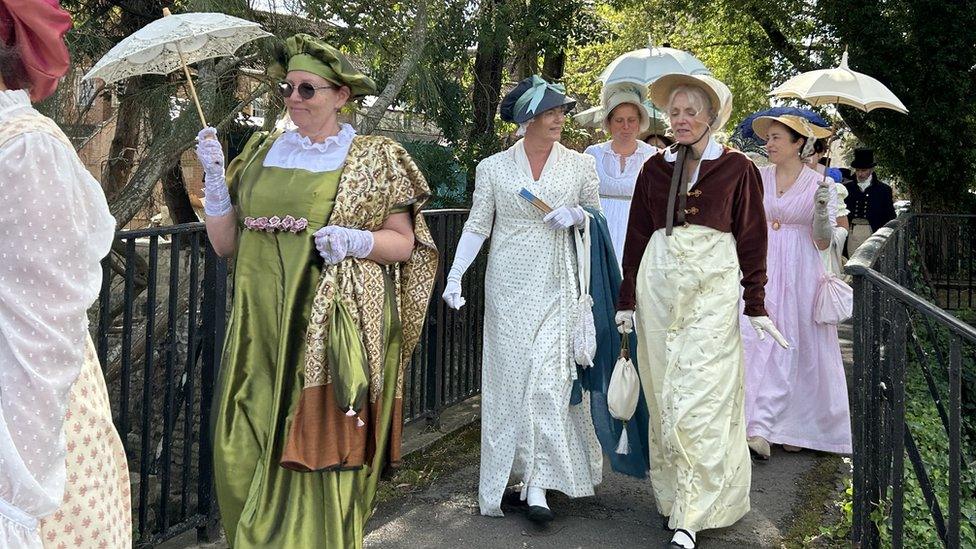 Women walking in period costume