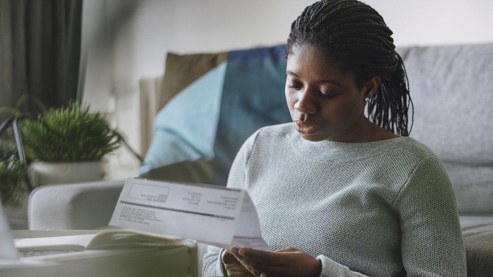 Woman looking at energy bill