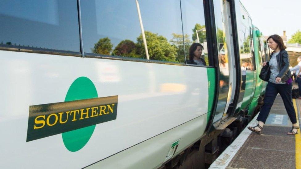 A woman boarding a train