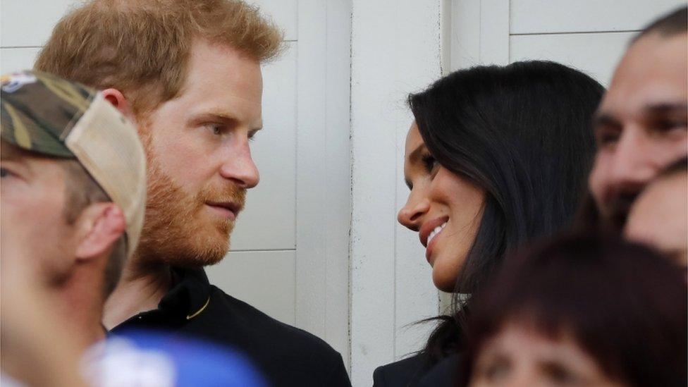 Prince Harry and wife Meghan in the stadium during the game