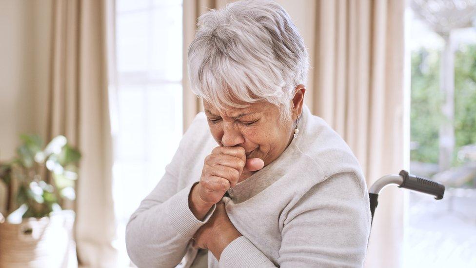 file picture of person sneezing